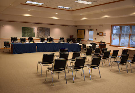 The board room in the Ligonier Township Municipal Building, set with tables and rows of chairs